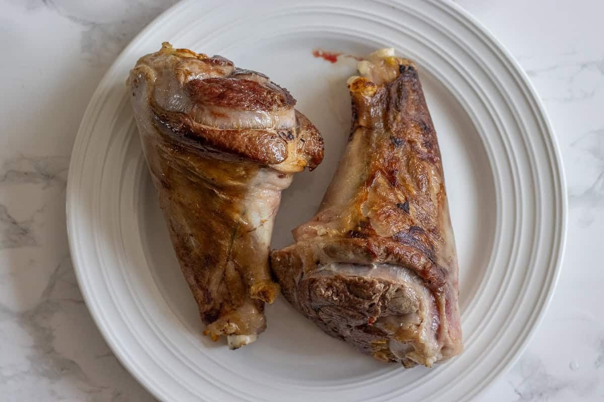 2 pieces of lamb shanks are seared for maximum flavor