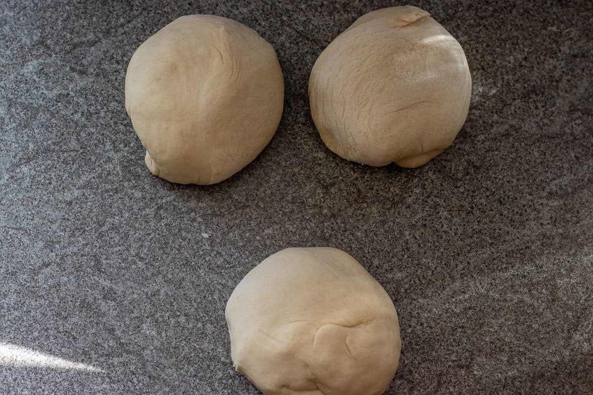 the bread dough is divided into 3 equal pieces