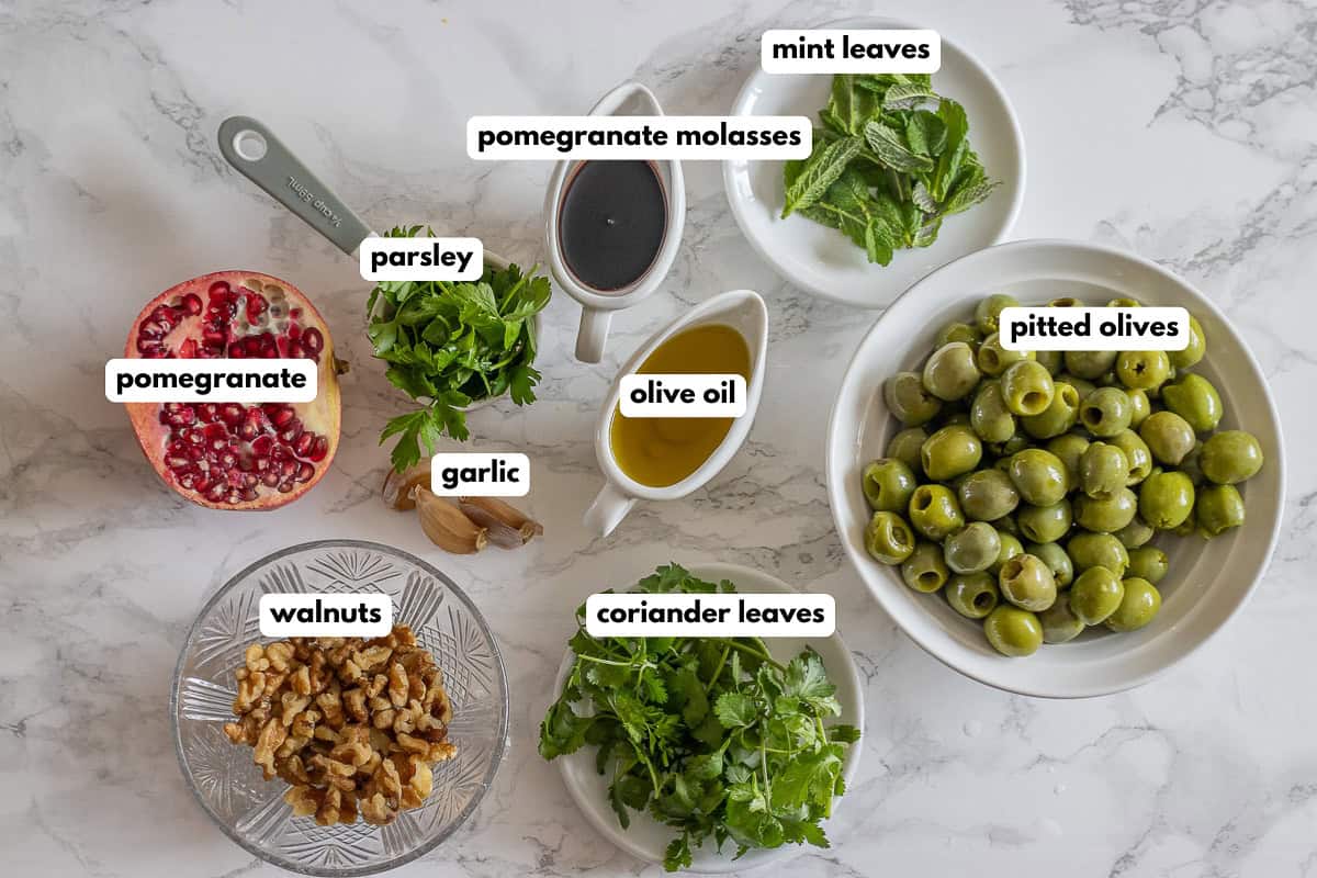 labelled picture of ingredients for zeytoon parvardeh - Persian marinated olive