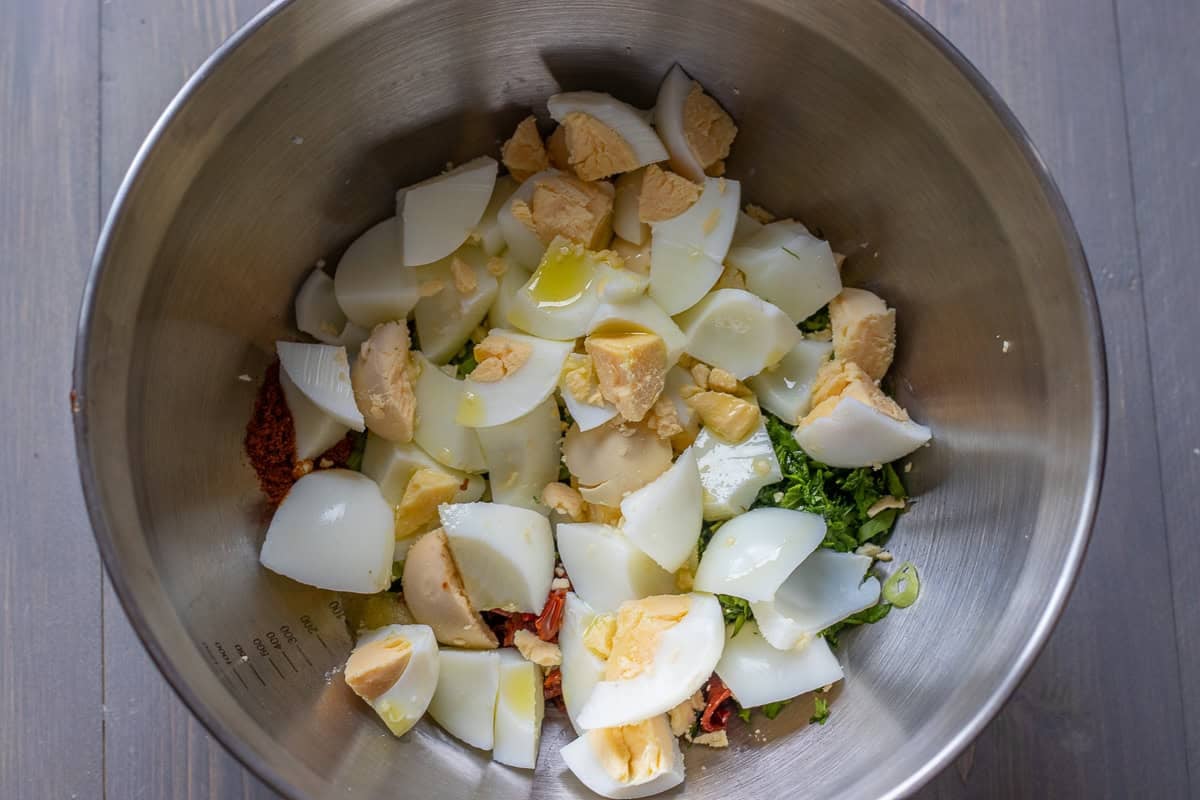 chopped hard boiled eggs are placed in a bowl