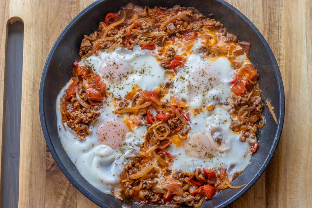 ground beef and eggs dish in a pan