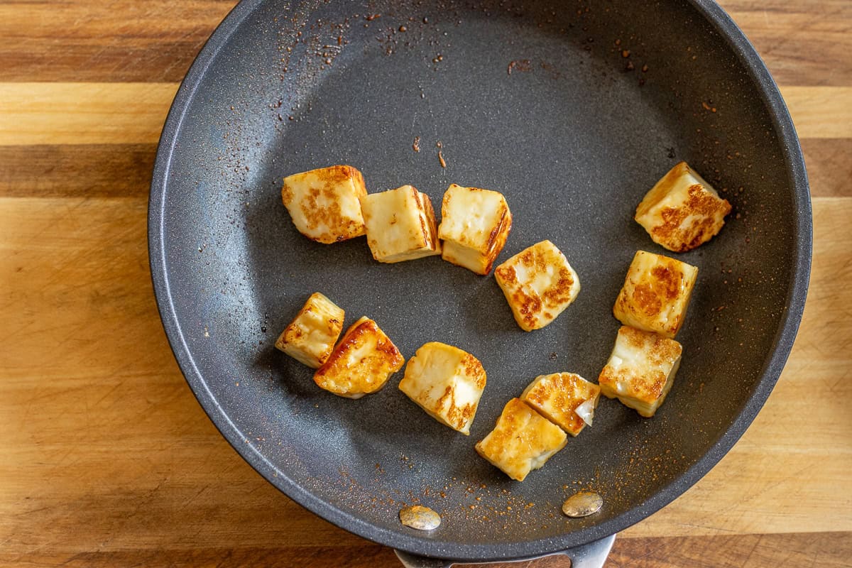 halloumi pieces are pan fried until golden