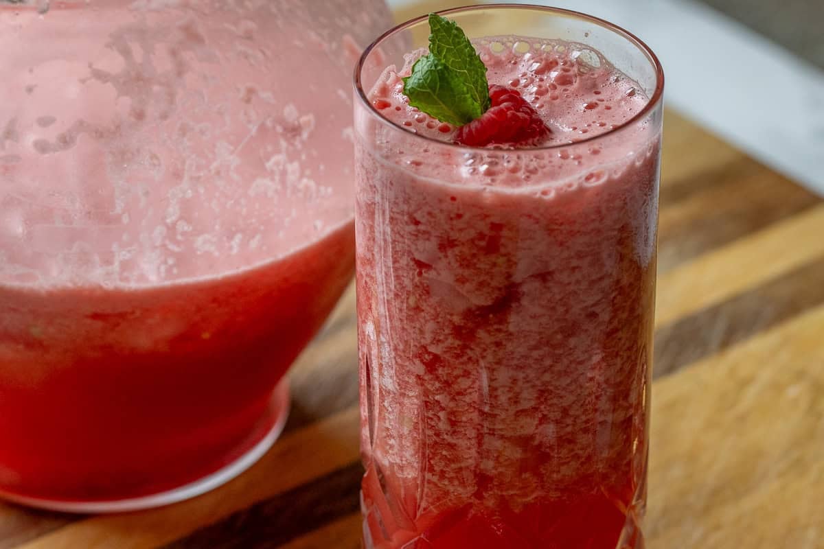 a jar and a glass of watermelon vodka