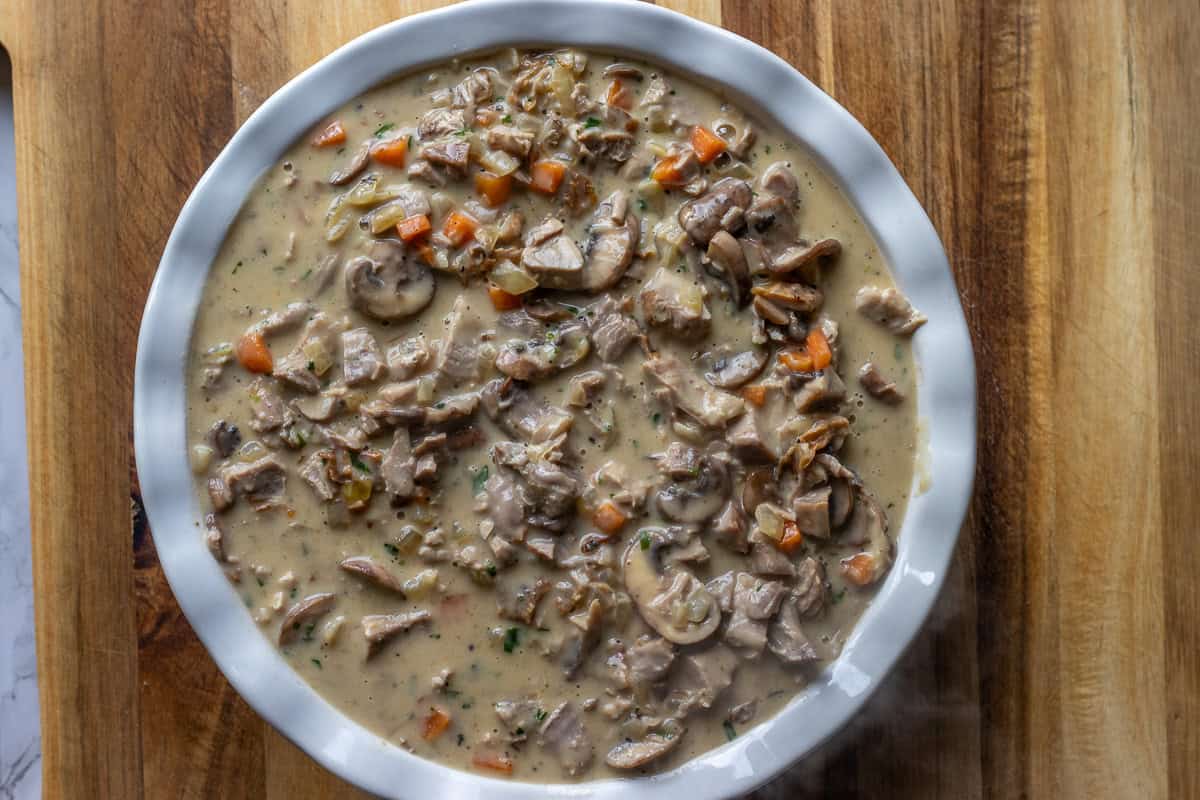 turkey filling placed in a pie dish