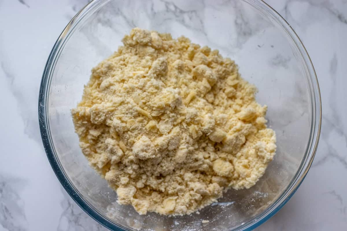 cold butter is mixed with flour