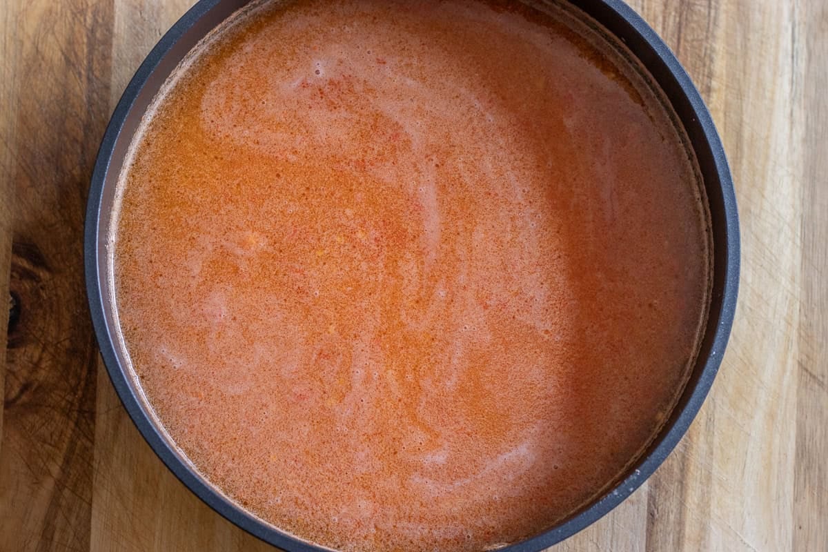 the liquid and rice is added to the pot