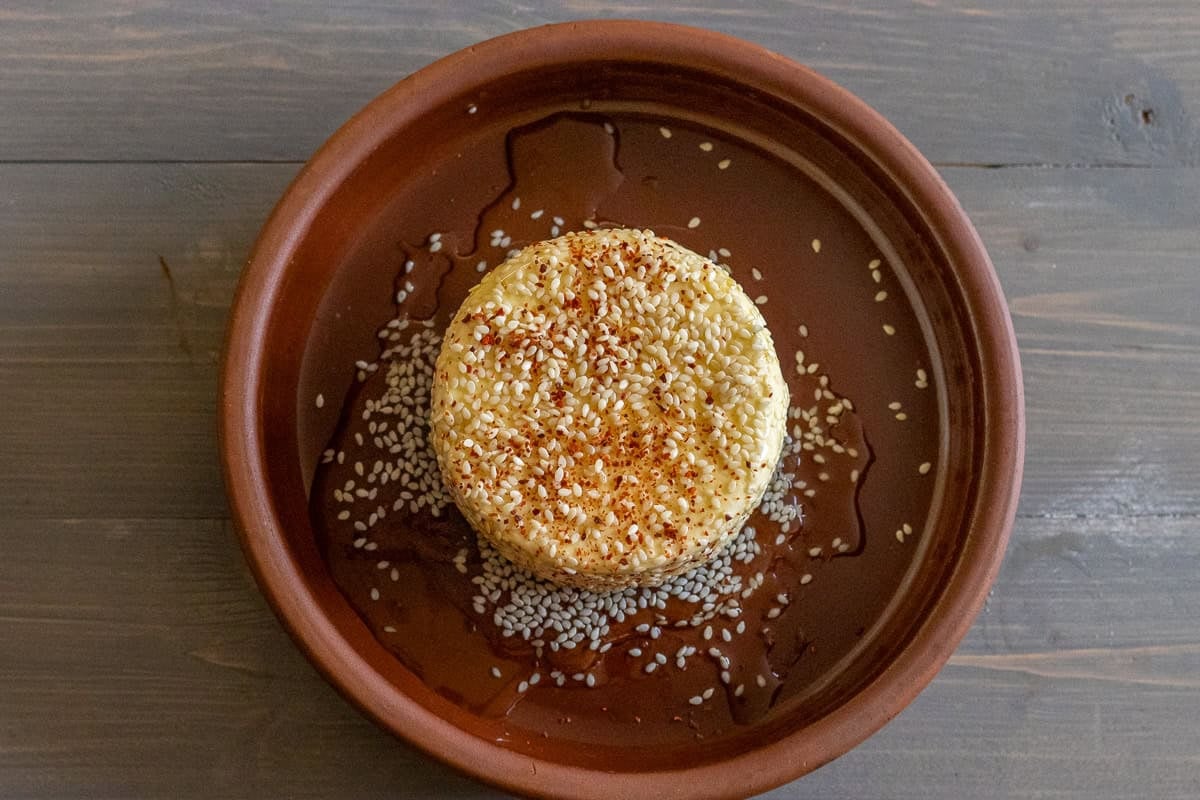 feta block covered with honey and sesame seeds