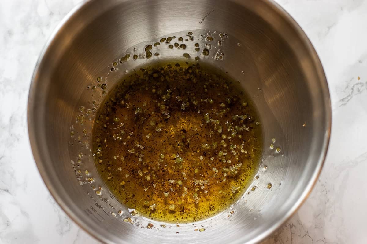 all ingredienst for salad dressing are placed in a small bowl