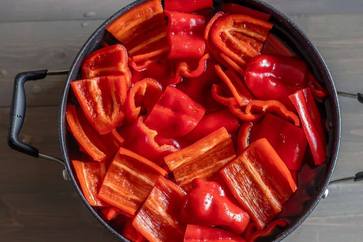 cut peppers are placed in a pot with water