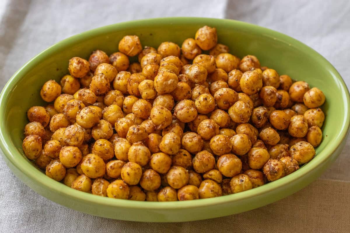 cripsy chickpeas roasted in an air fryer and served in a green bowl